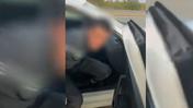 Мужчину посадили в полицейский автомобиль